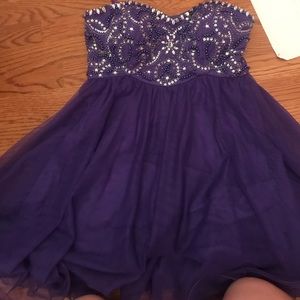 Strapless purple prom dress